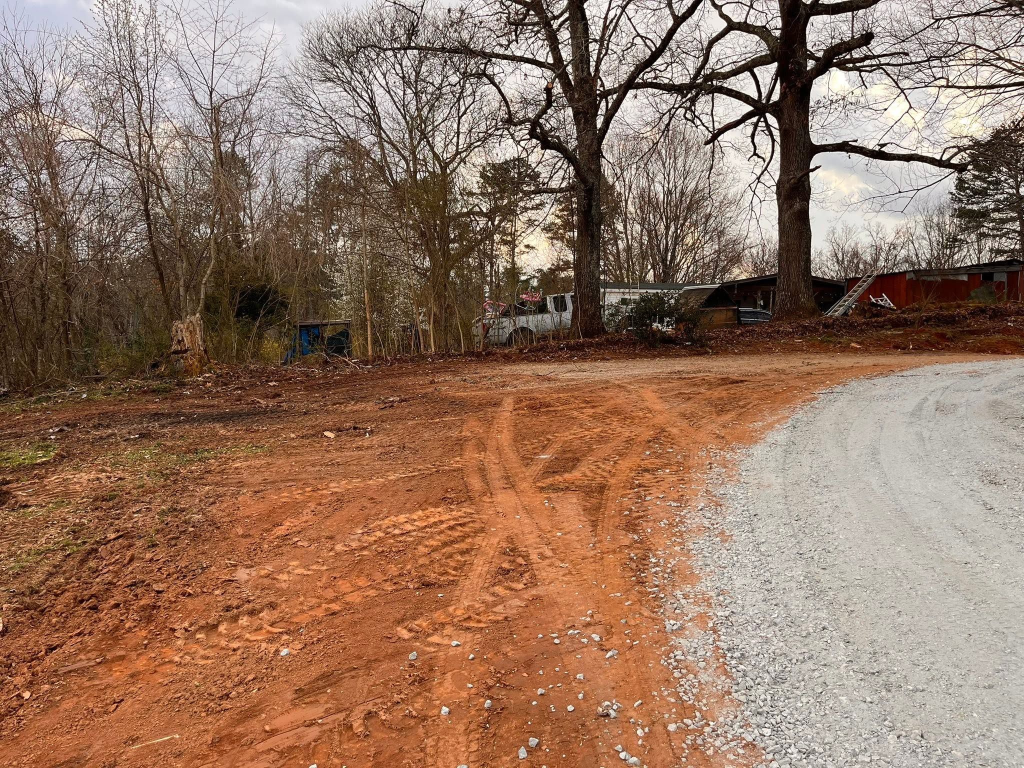 Finished graded driveway transition with compacted gravel